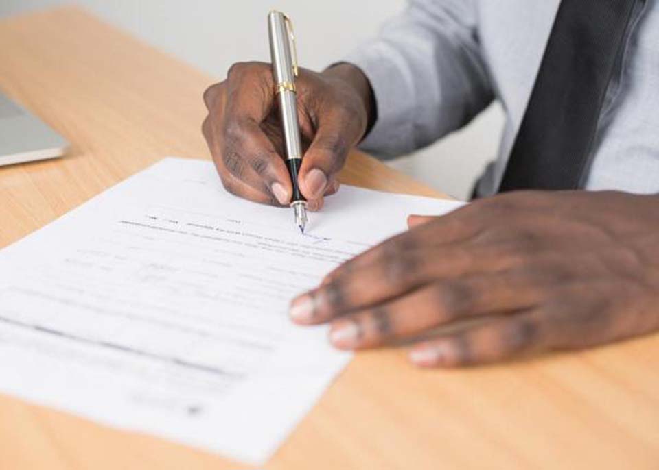 person filling out forms